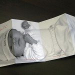 A contemporary, custom tri-fold baby birth announcement that opens up to almost actual size photo of baby.