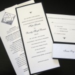 A modern, black and white custom wedding invitation set with insert and reply postcard.