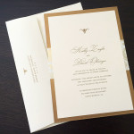 A modern, traditional gold and ivory custom wedding invitation set.