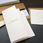 A modern, traditional custom 4 panel accordion fold wedding invitation set with reply card and envelope.