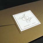 A classy, traditional, custom gold and ivory wedding invitation set.