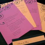A contemporary, custom wedding invitation set with inserts and reply postcard.