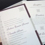 A modern, custom plum and silver wedding invitation set with insert.